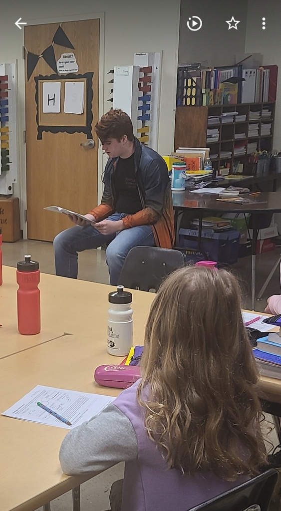 Alex reads to sixth graders